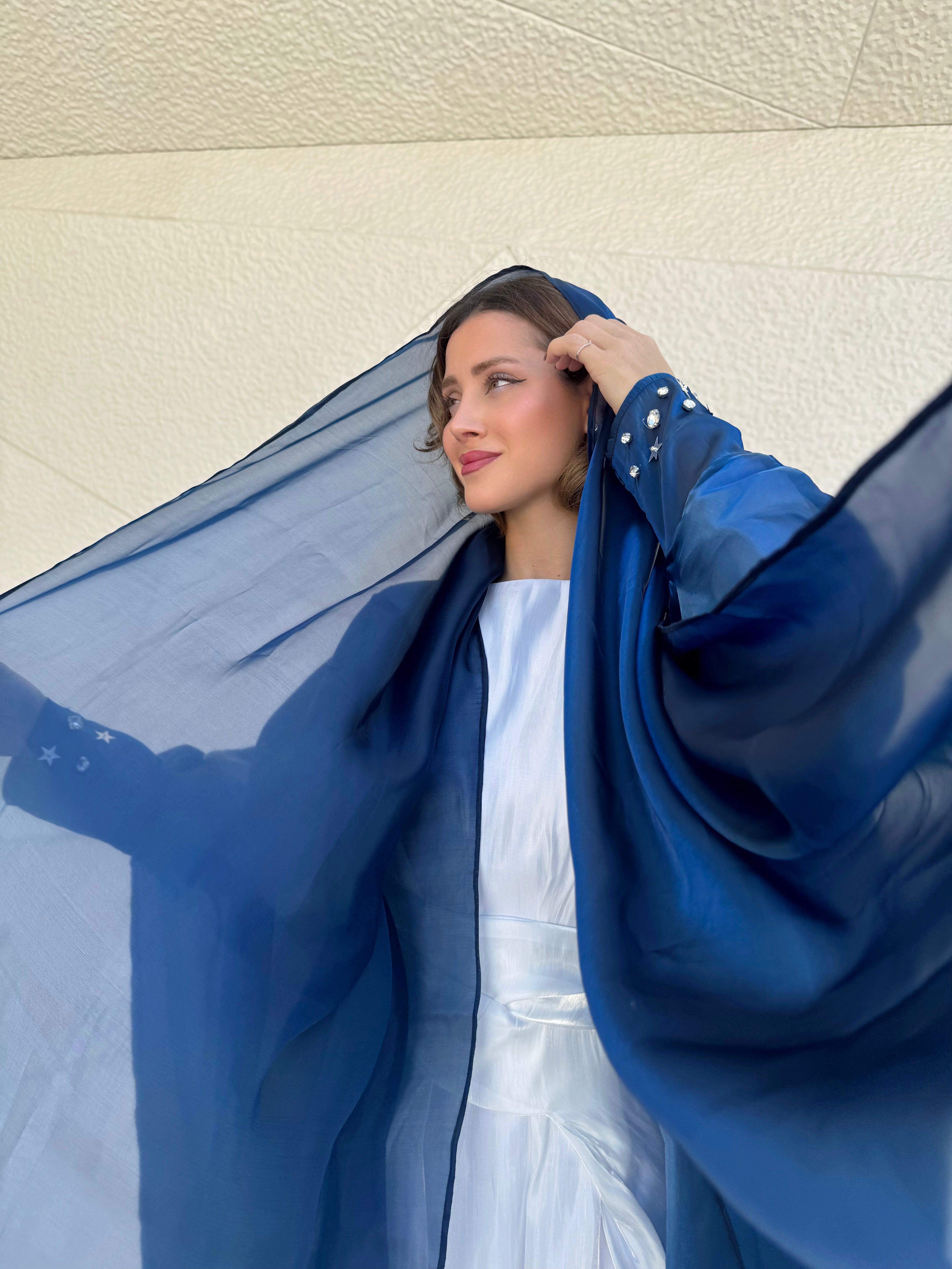Blue organza Abaya with a white Dress