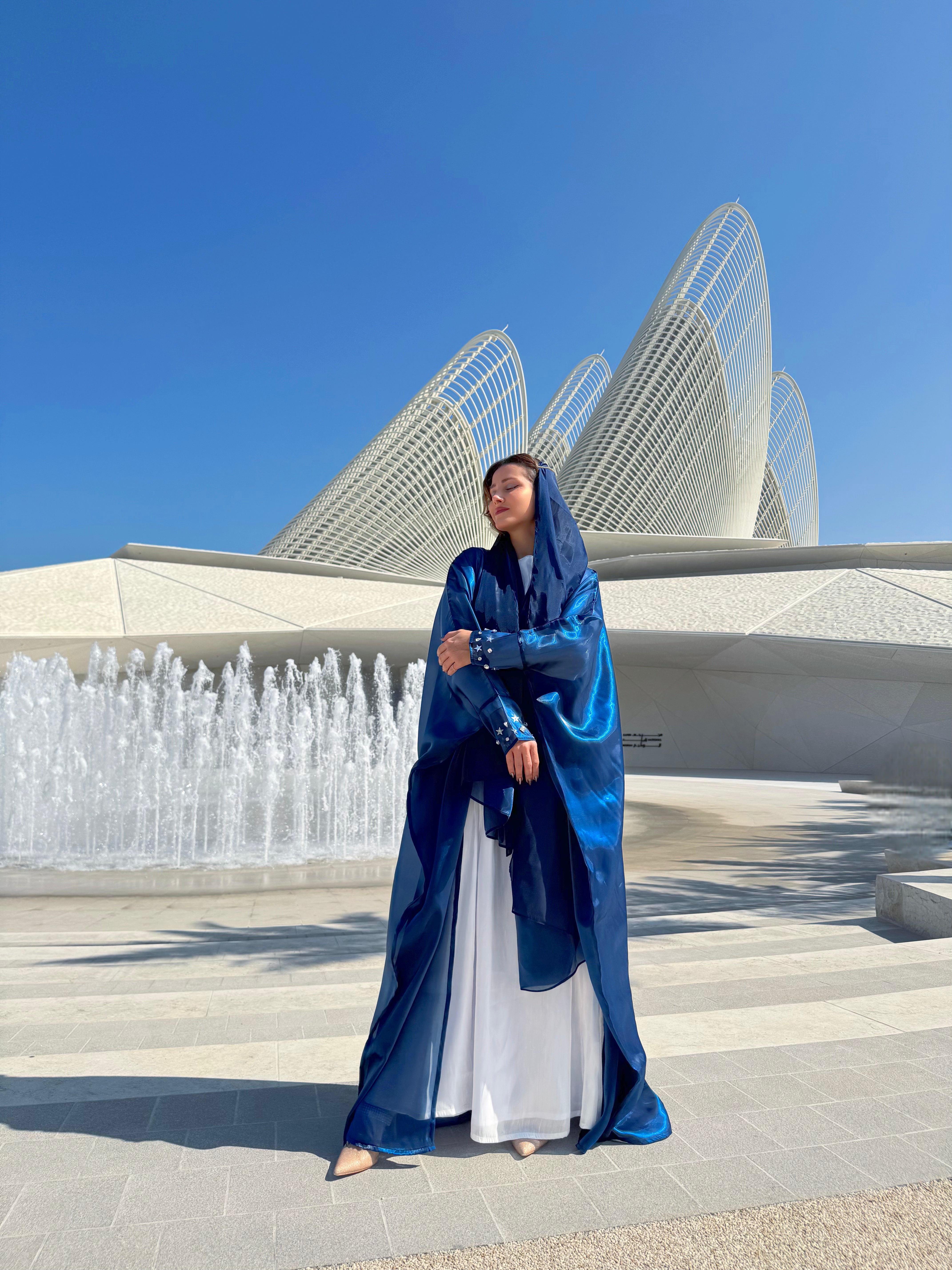 Blue organza Abaya with a white Dress
